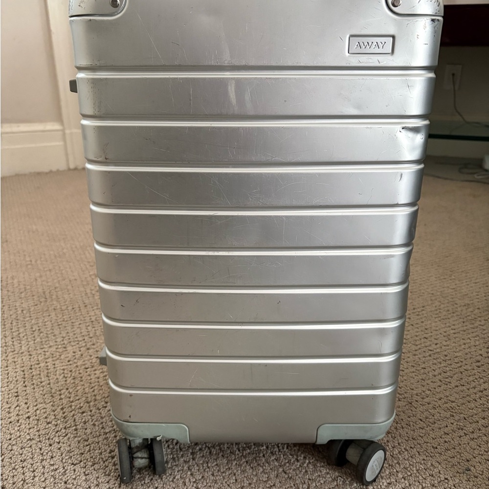 Away Metallic Silver Rolling Suitcase